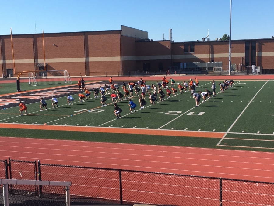 image of people on a track and field